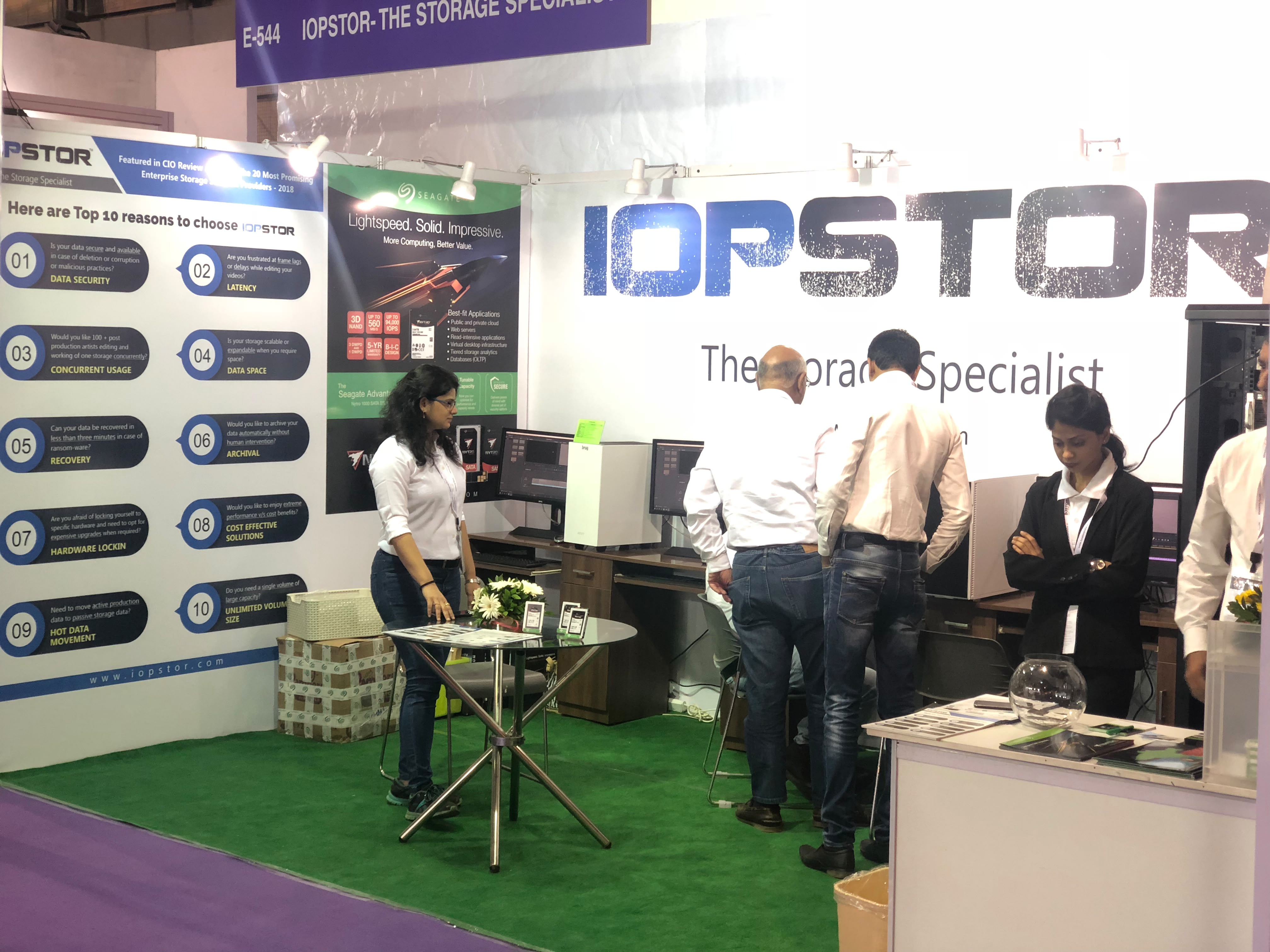 Visitors at IOPSTOR's demo workstations, stall E-544